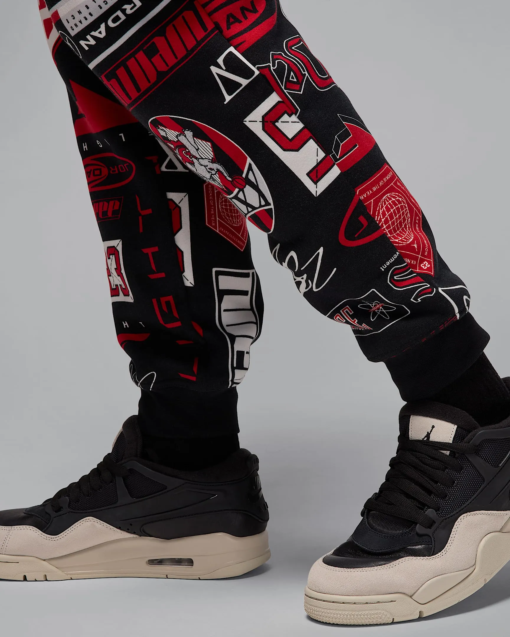 Nike Men's Jordan Essentials Printed Fleece Pants Apparel - Black / Varsity Red