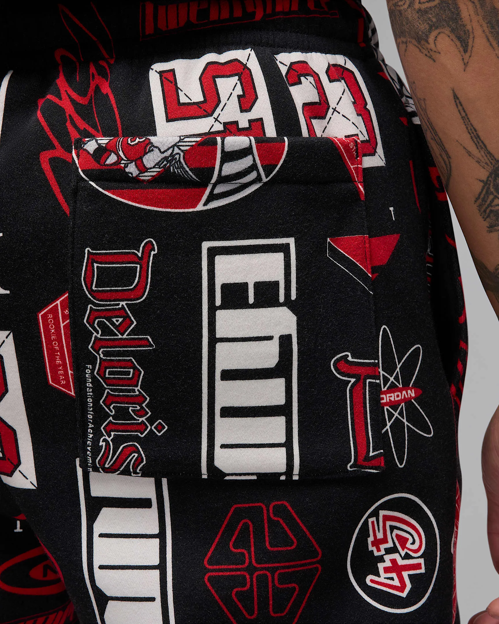 Nike Men's Jordan Essentials Printed Fleece Pants Apparel - Black / Varsity Red