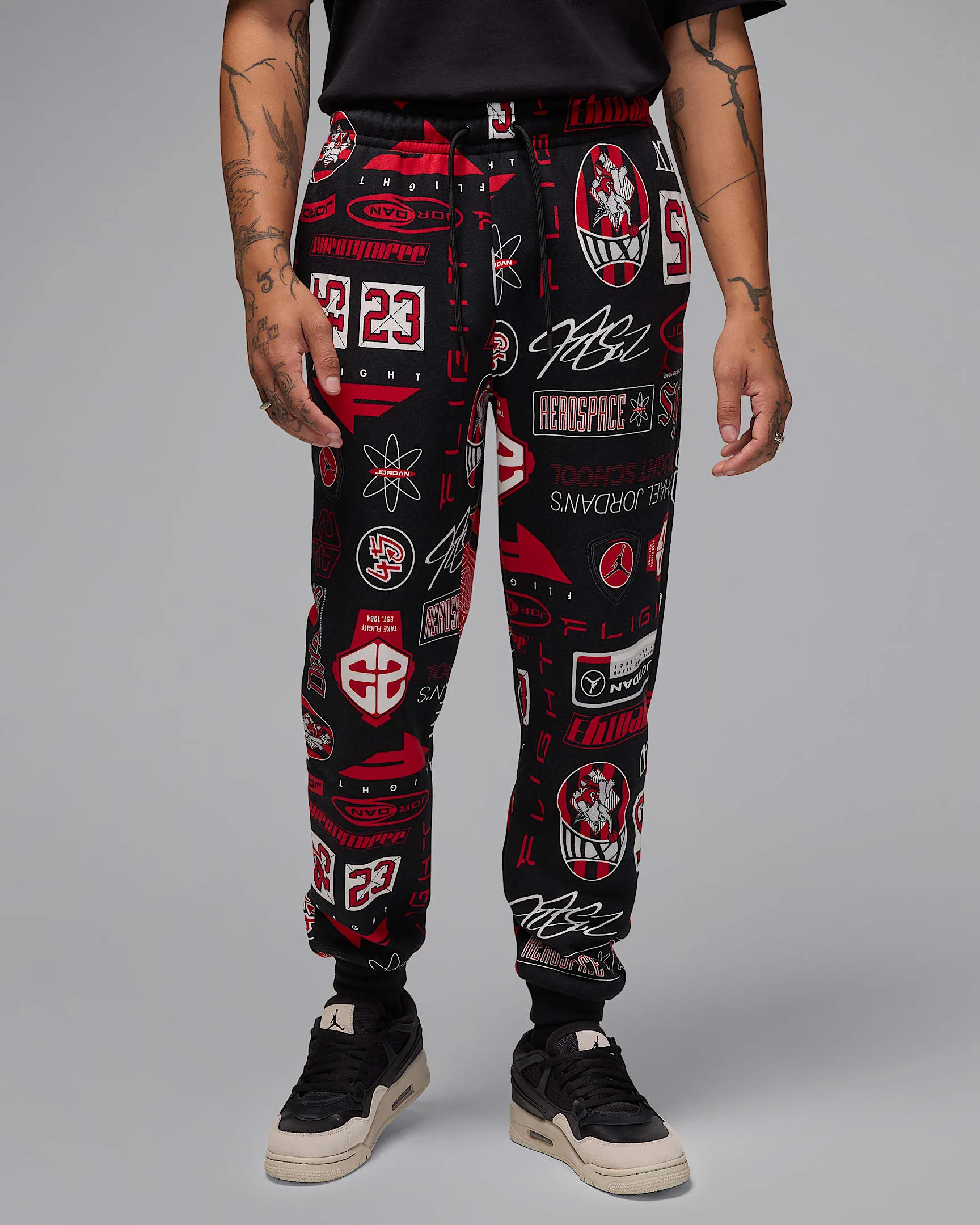 Nike Men's Jordan Essentials Printed Fleece Pants Apparel - Black / Varsity Red