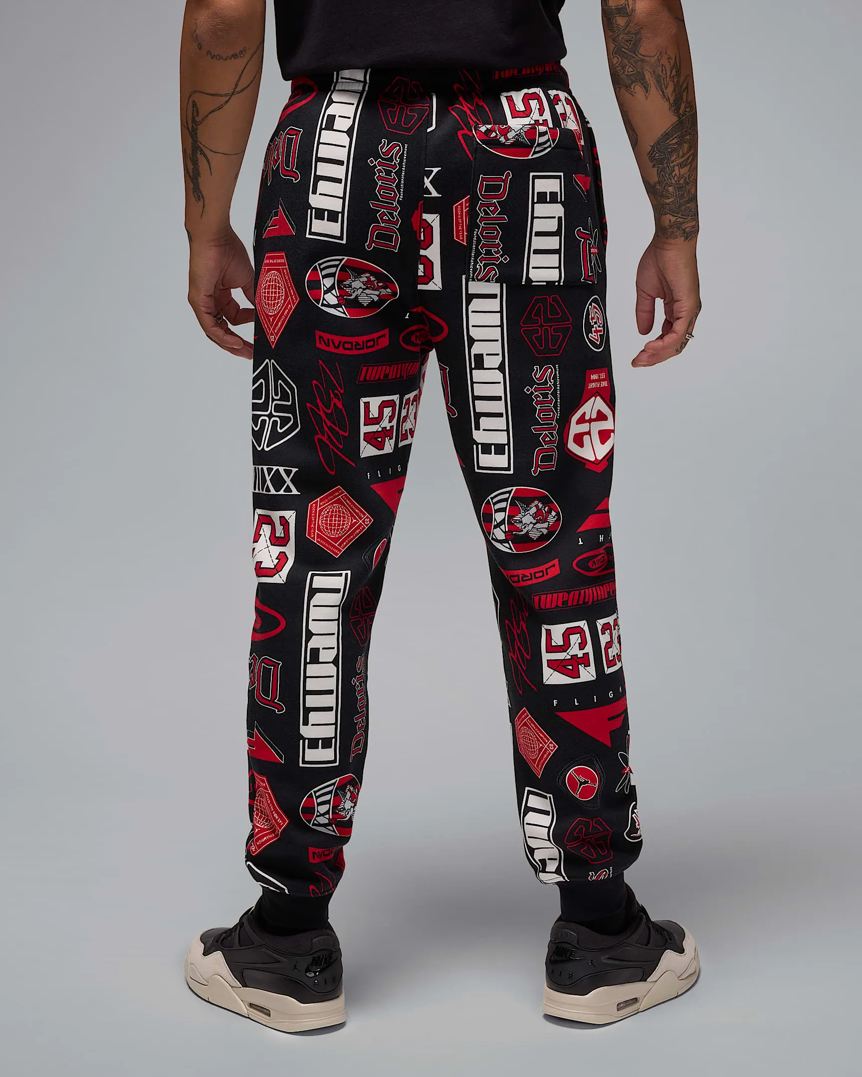 Nike Men's Jordan Essentials Printed Fleece Pants Apparel - Black / Varsity Red